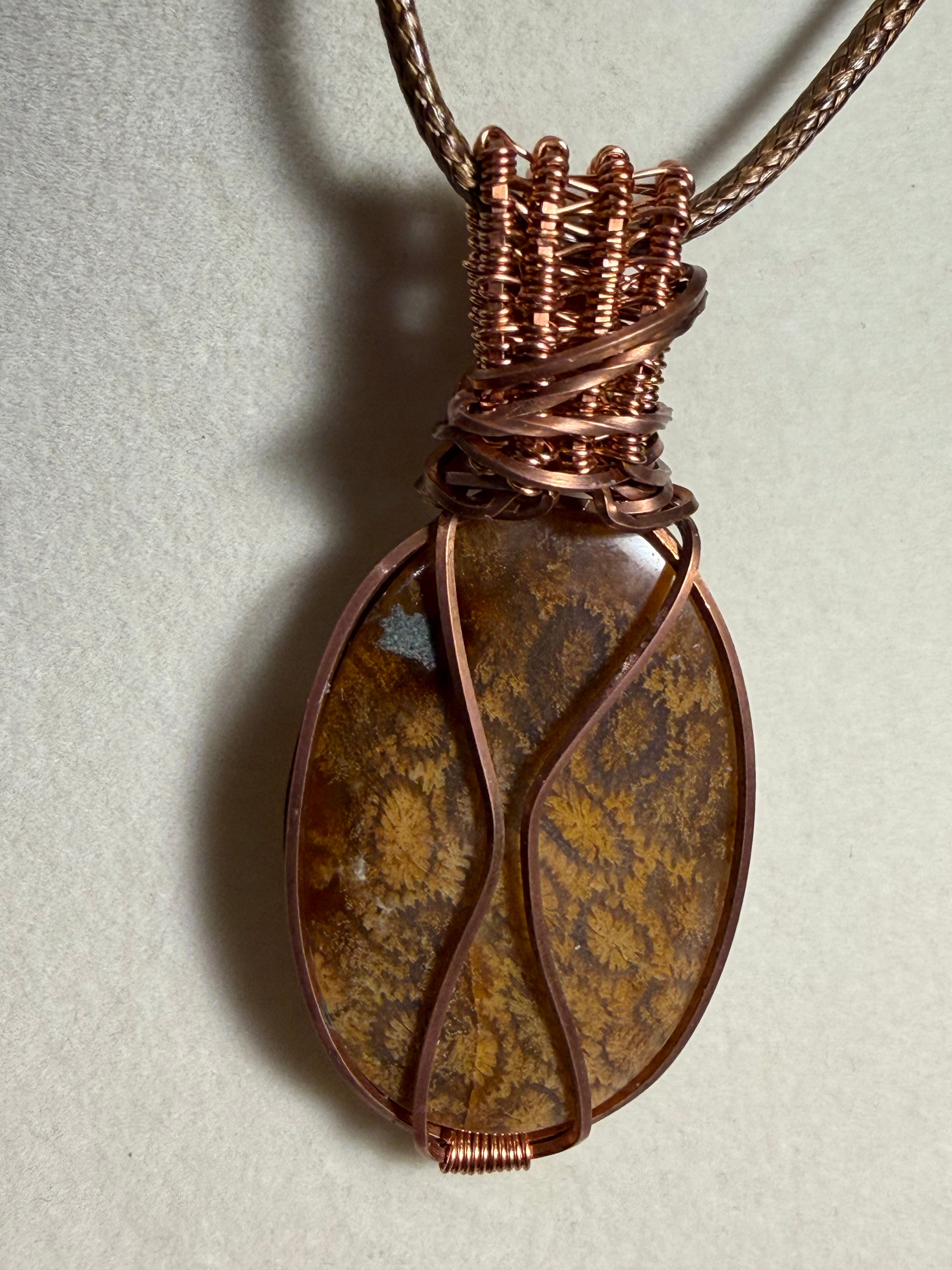 Fossil Coral & Garnet copper wire-wrapped pendant