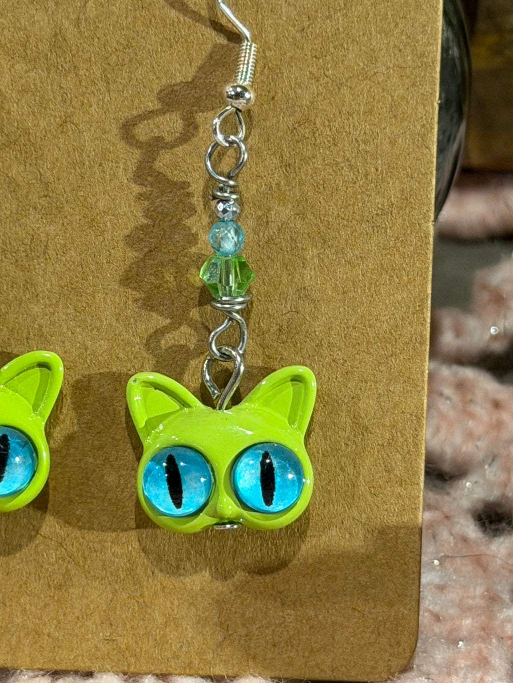 Blue Topaz & glass green cat head earrings