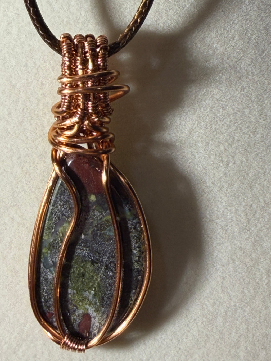 Dragon Stone & Garnet copper wire-wrapped pendant