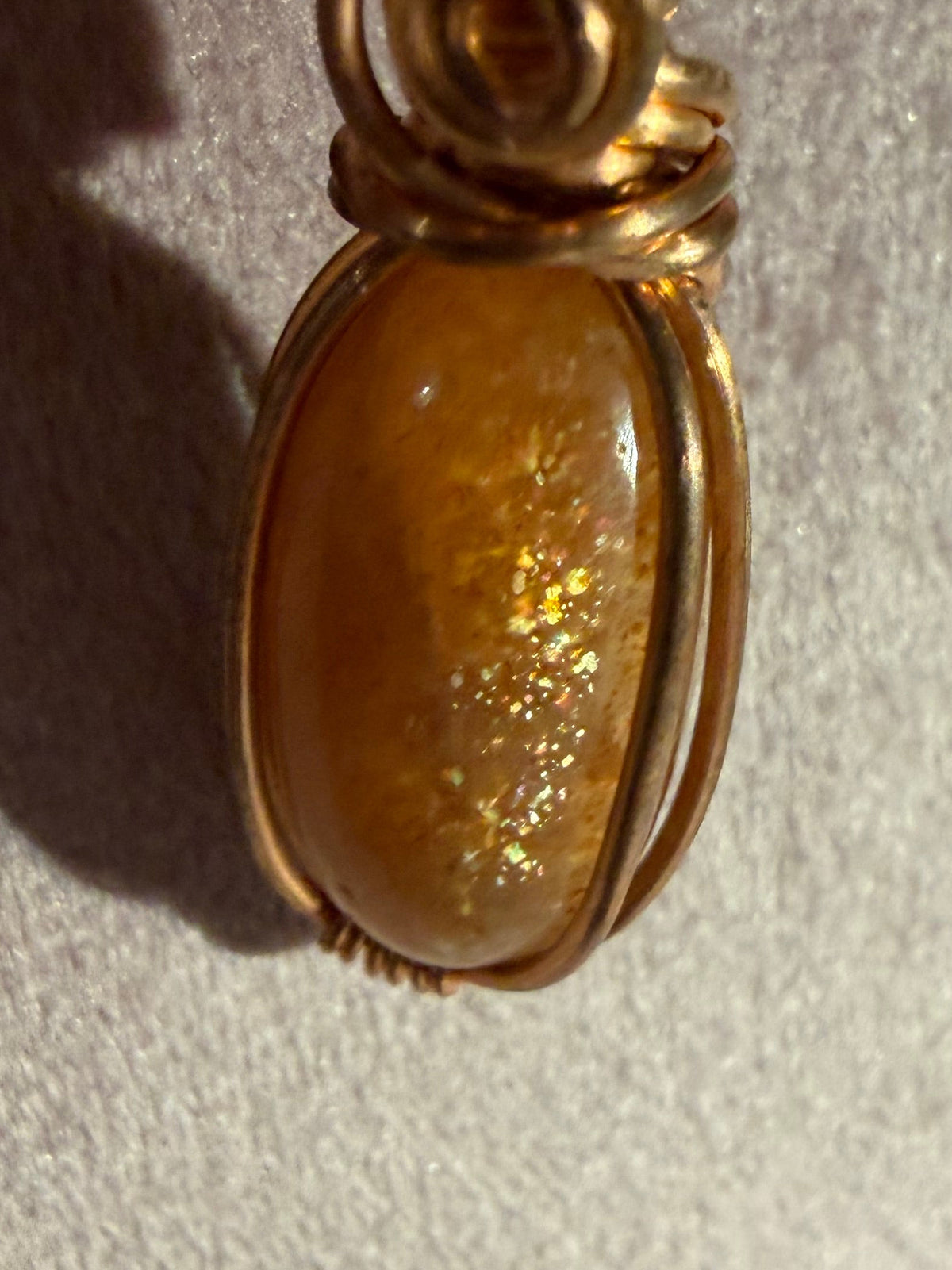 Confetti Sunstone copper wire-wrapped pendant