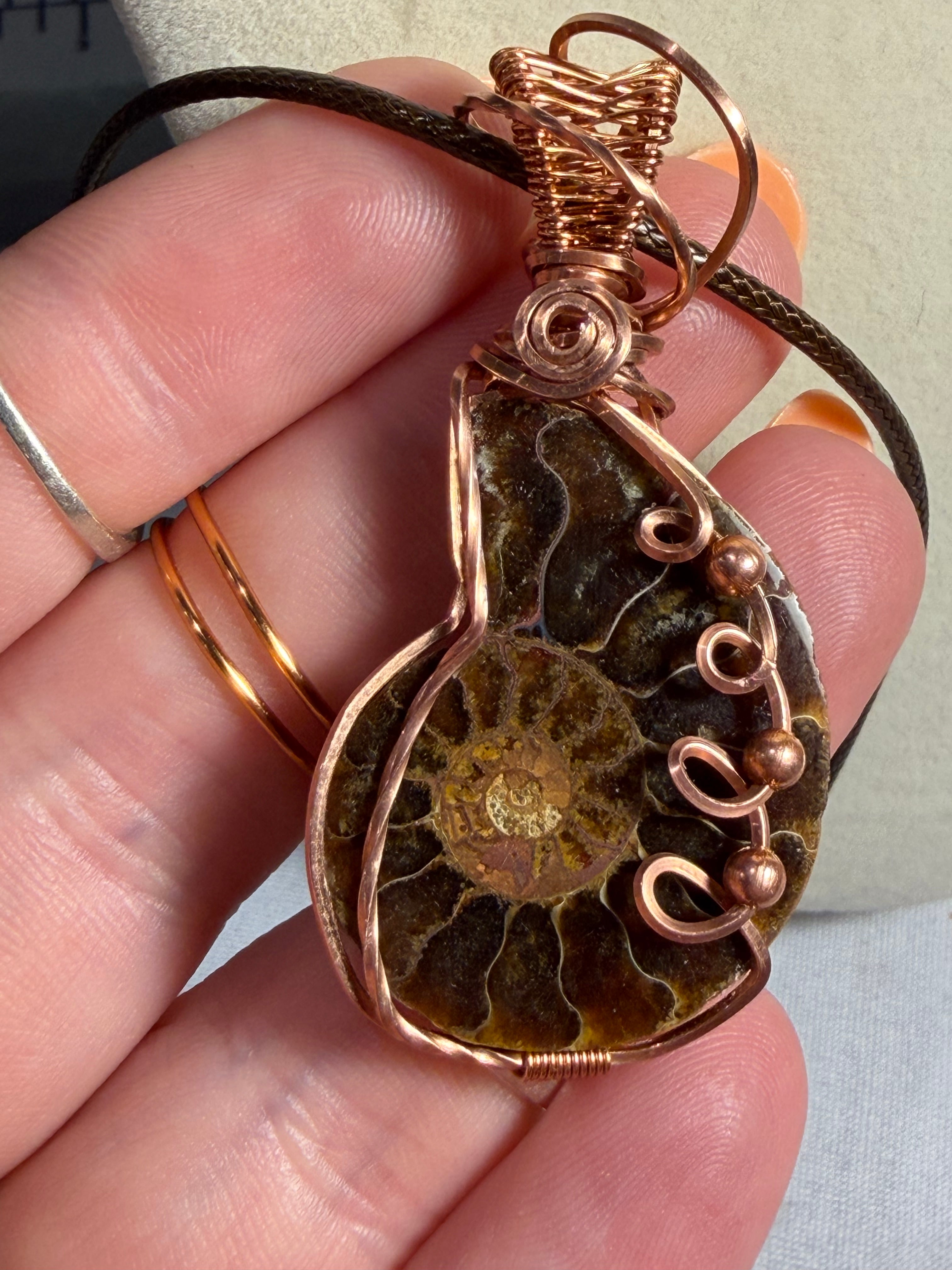 Ammonite fossil copper wire-wrapped pendant
