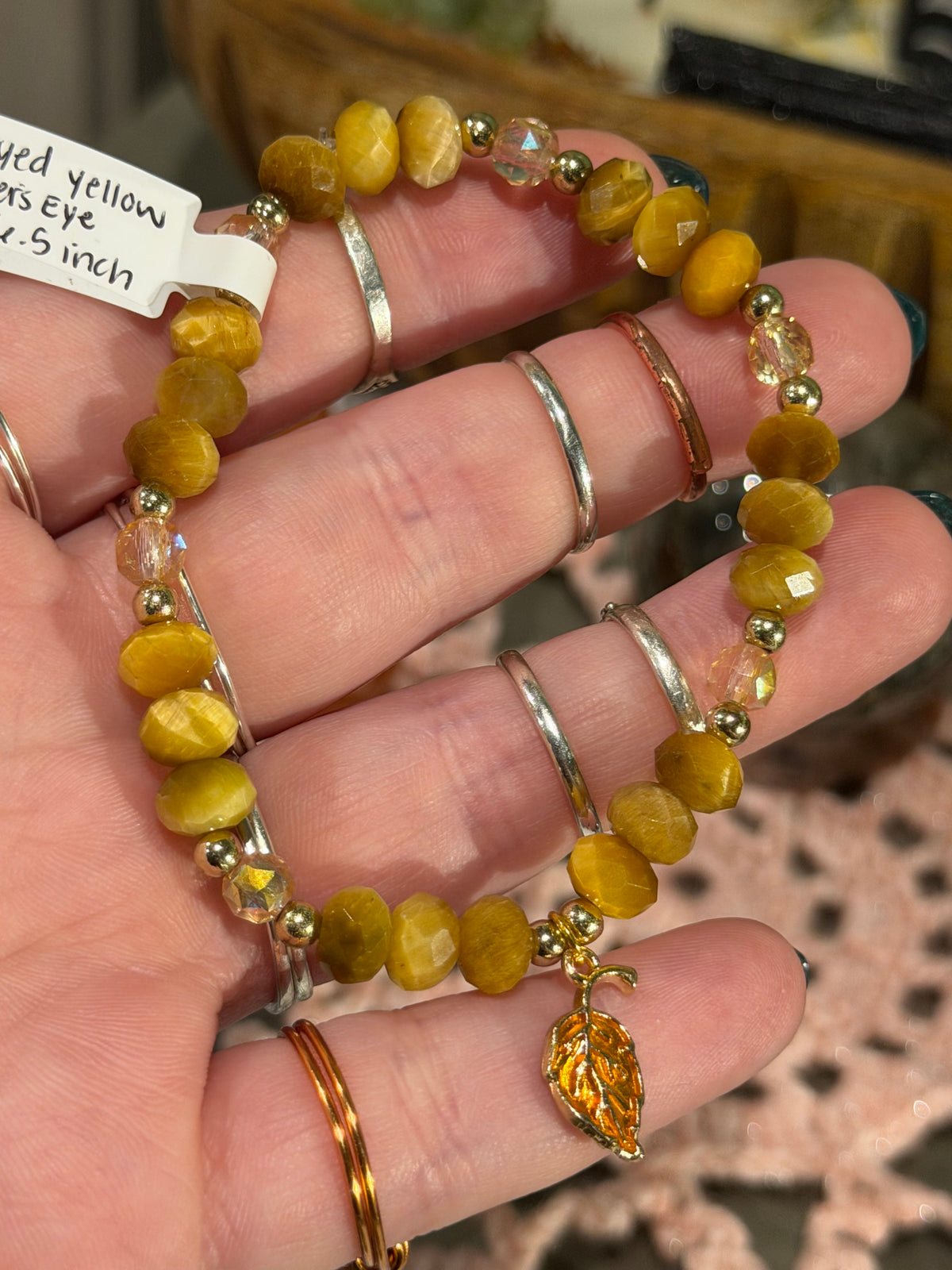 faceted dyed yellow Tiger's Eye 6.5-inch stretchy bracelet with leaf charm