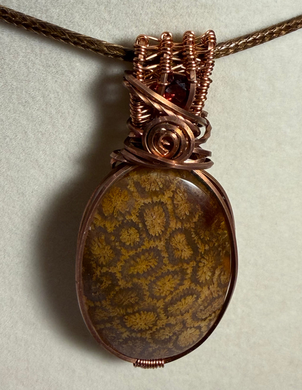 Fossil Coral & Garnet copper wire-wrapped pendant