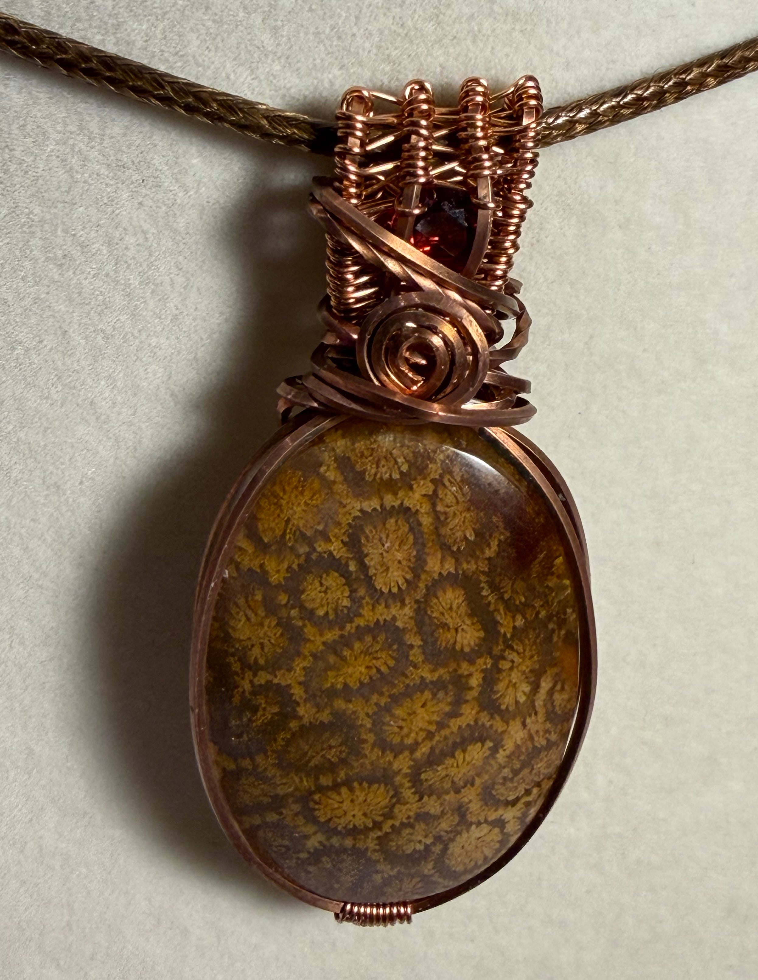 Fossil Coral & Garnet copper wire-wrapped pendant