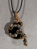 Obsidian copper wire-wrapped moon pendant
