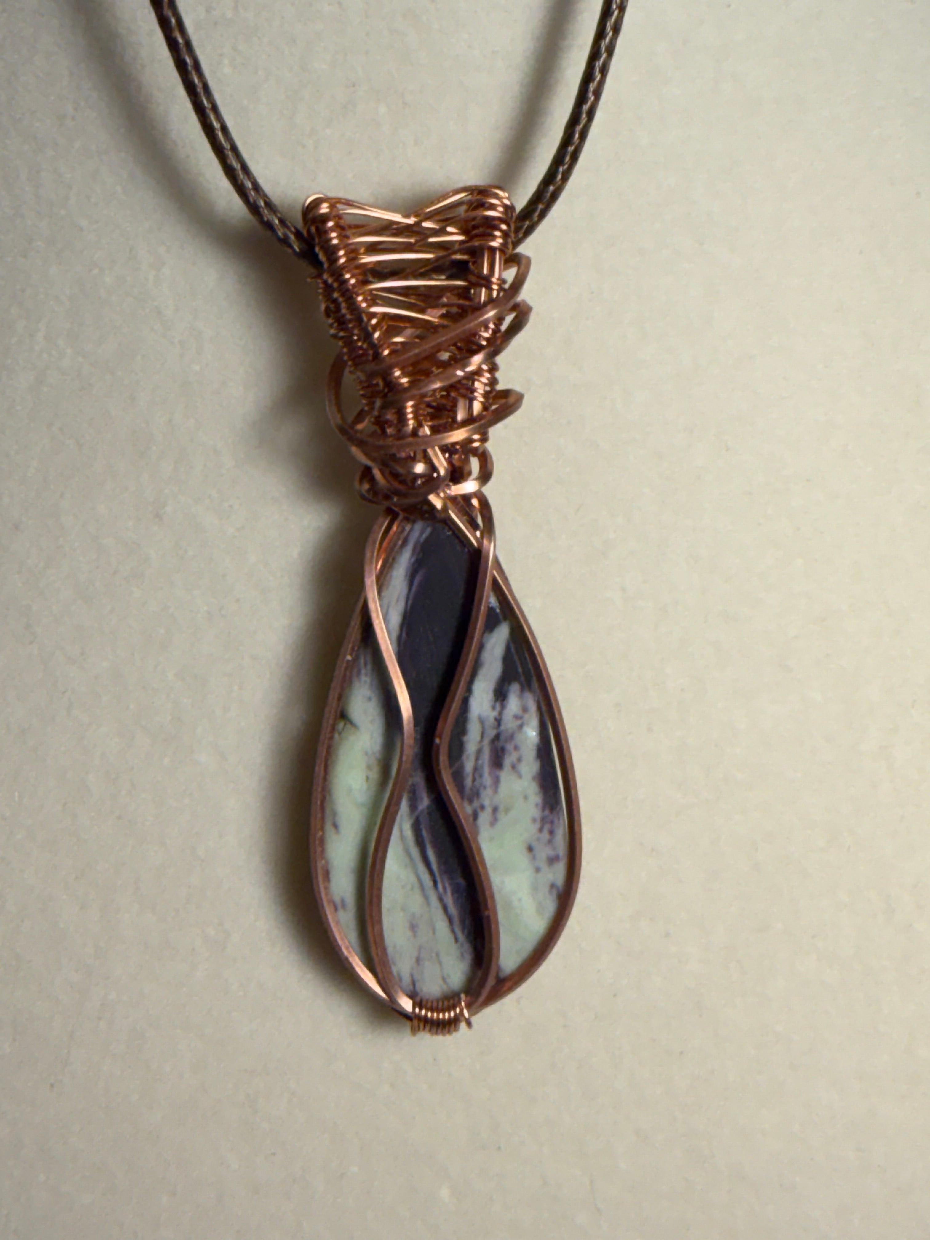 Kammererite copper wire-wrapped pendant