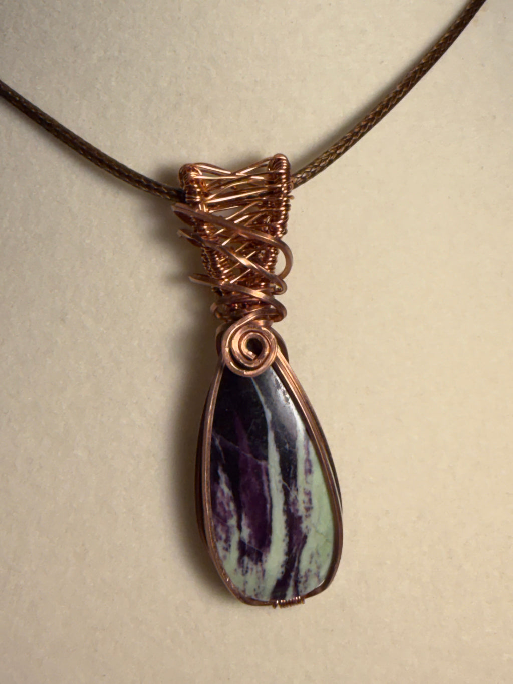 Kammererite copper wire-wrapped pendant