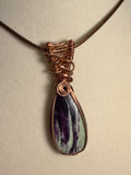 Kammererite copper wire-wrapped pendant