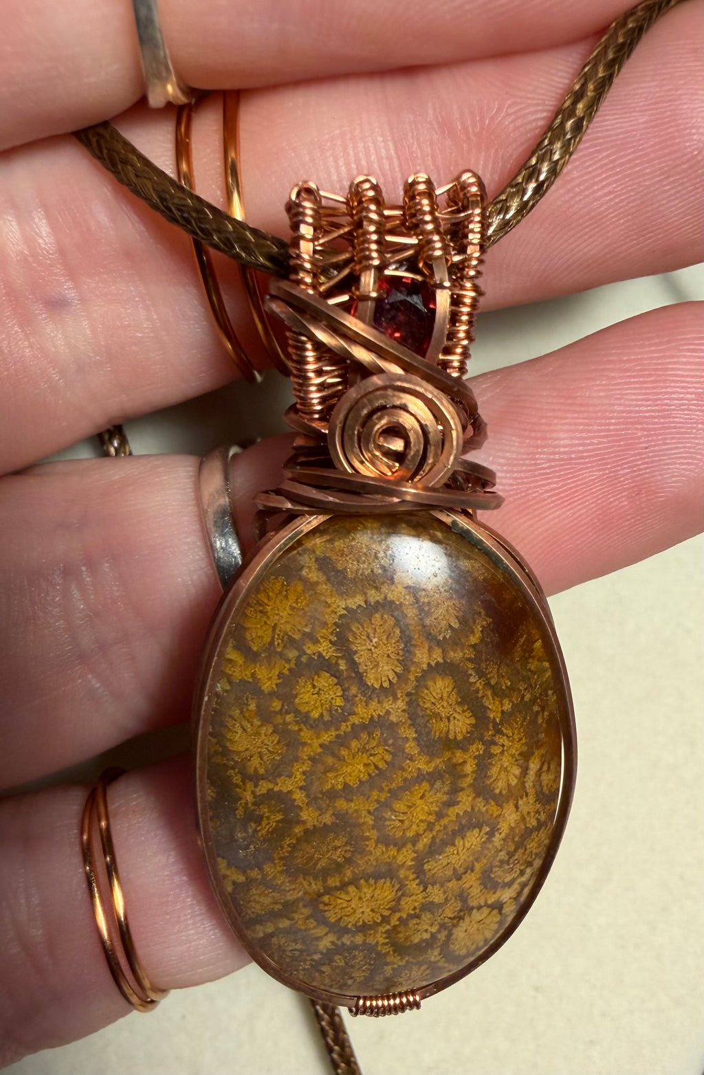 Fossil Coral & Garnet copper wire-wrapped pendant