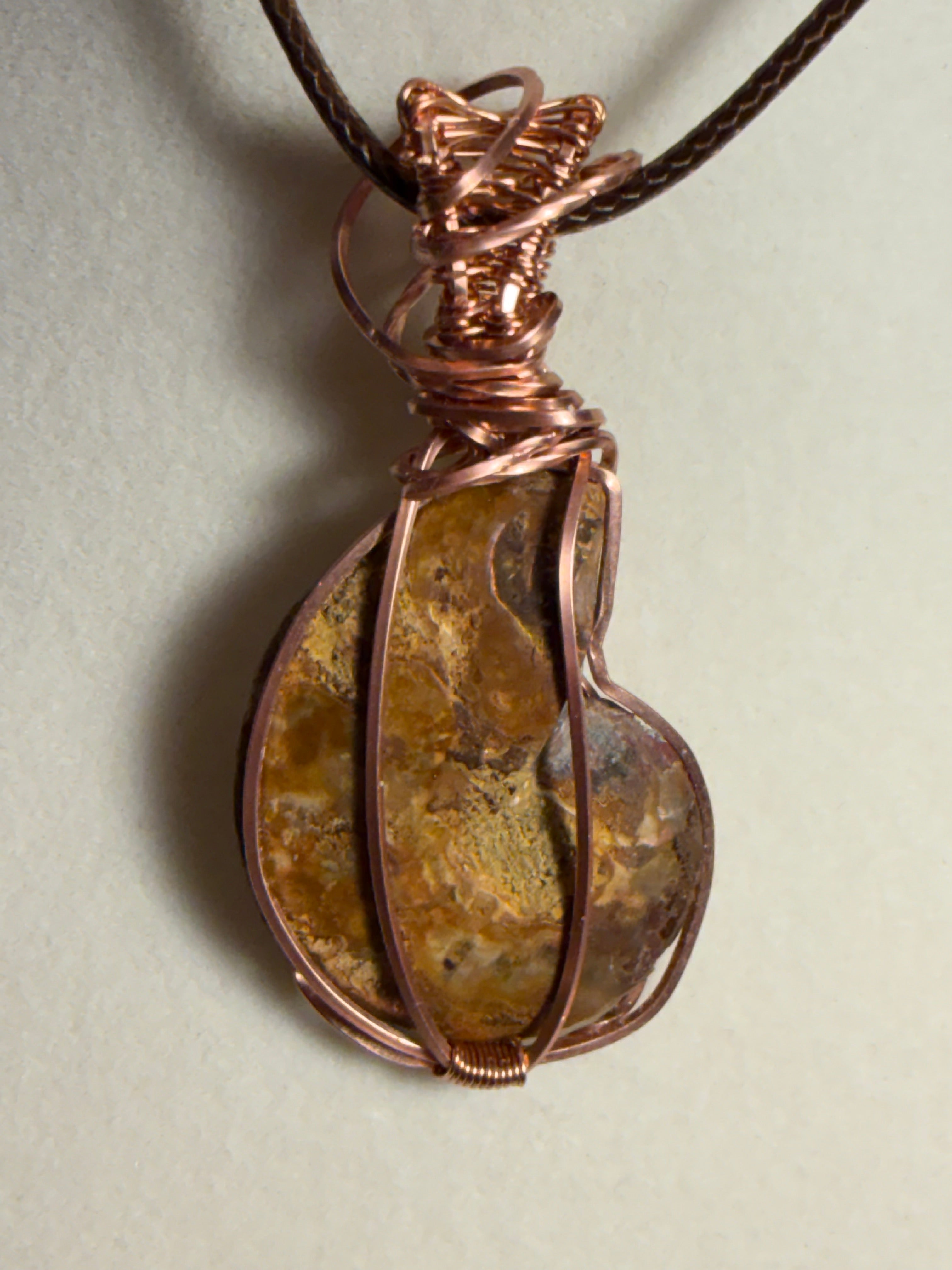Ammonite fossil copper wire-wrapped pendant