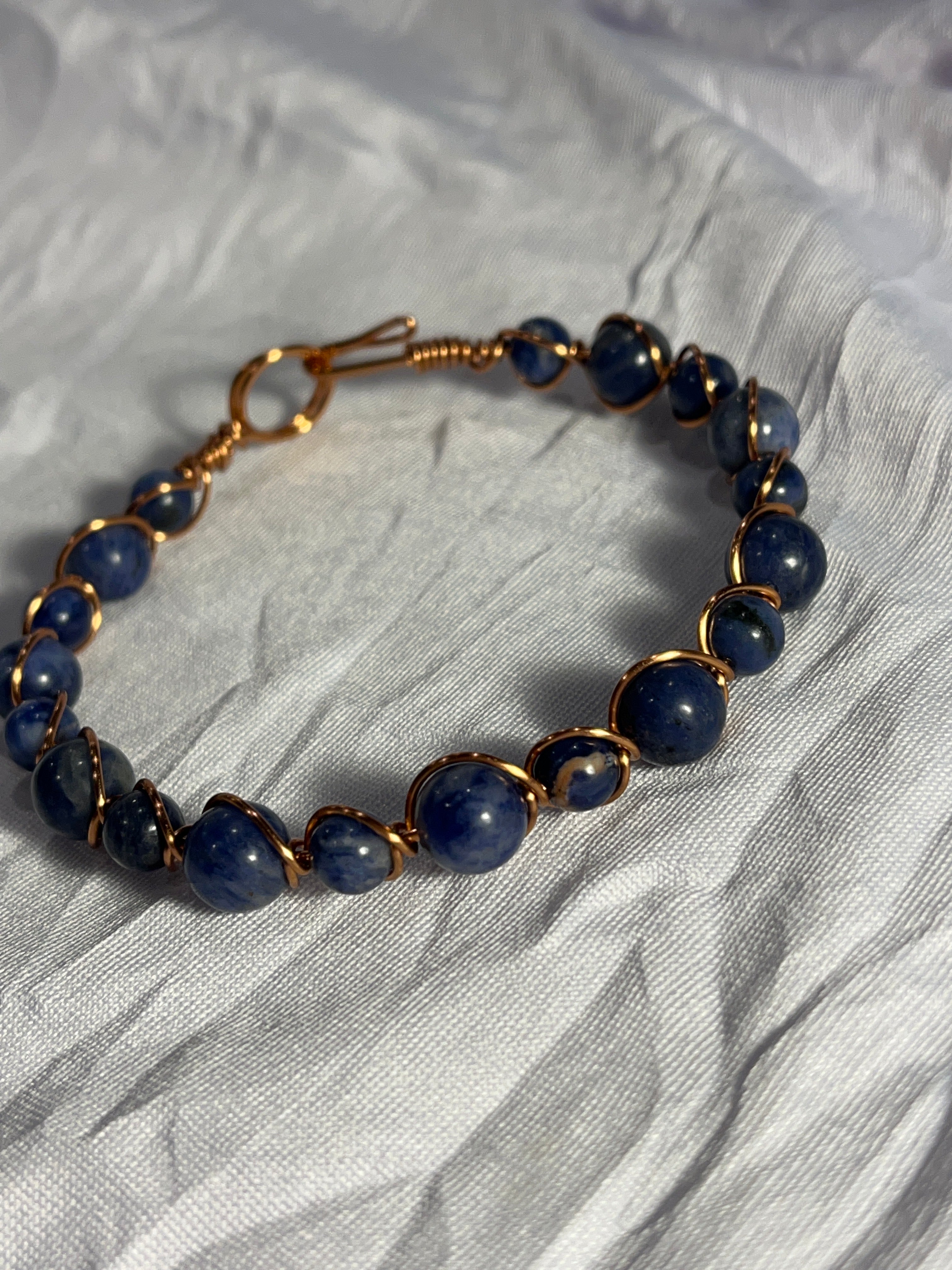 Sodalite 7.5 inch copper wire-wrapped bracelet