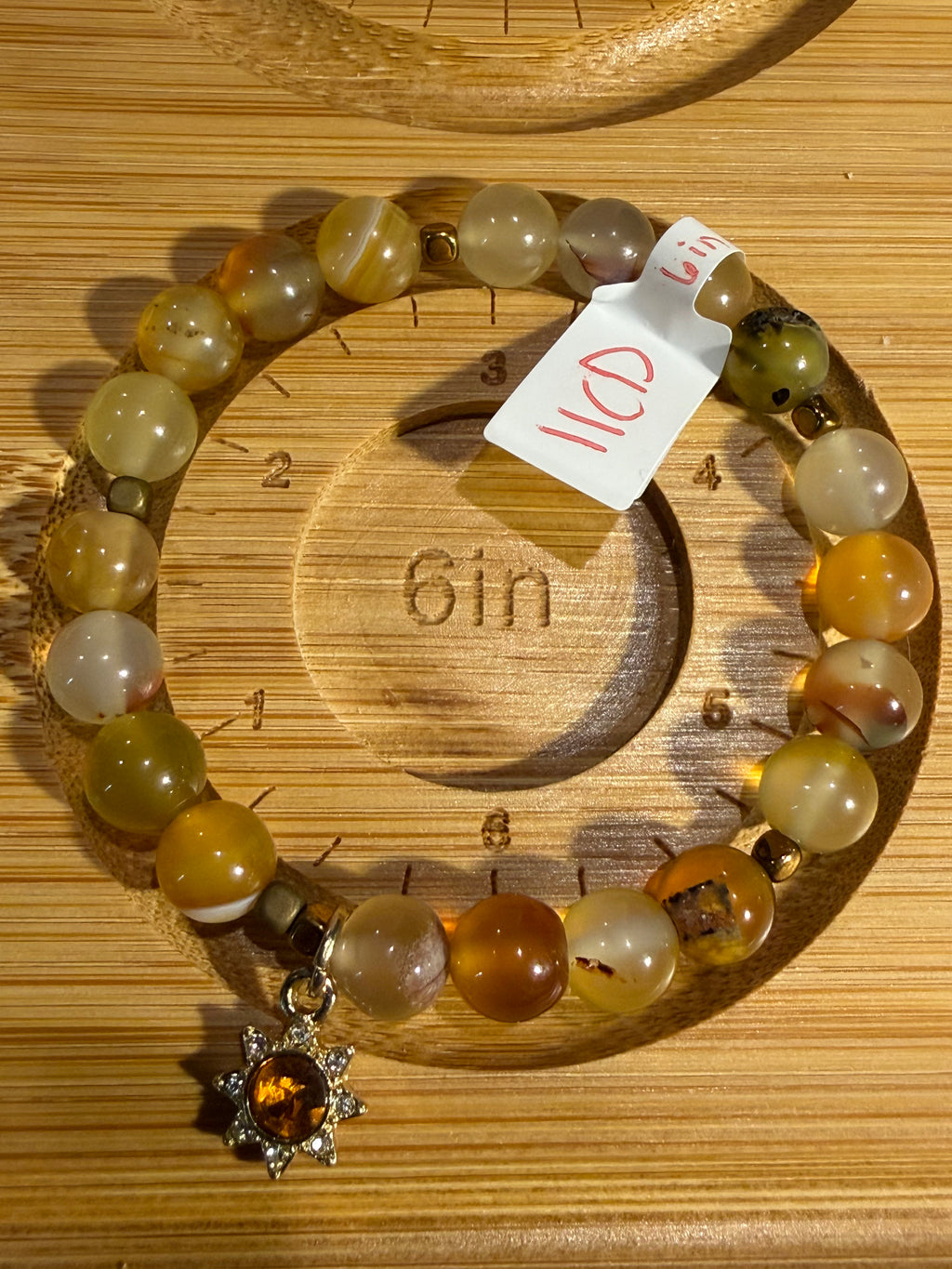 Amber 6-inch stretchy bracelet with sun charm