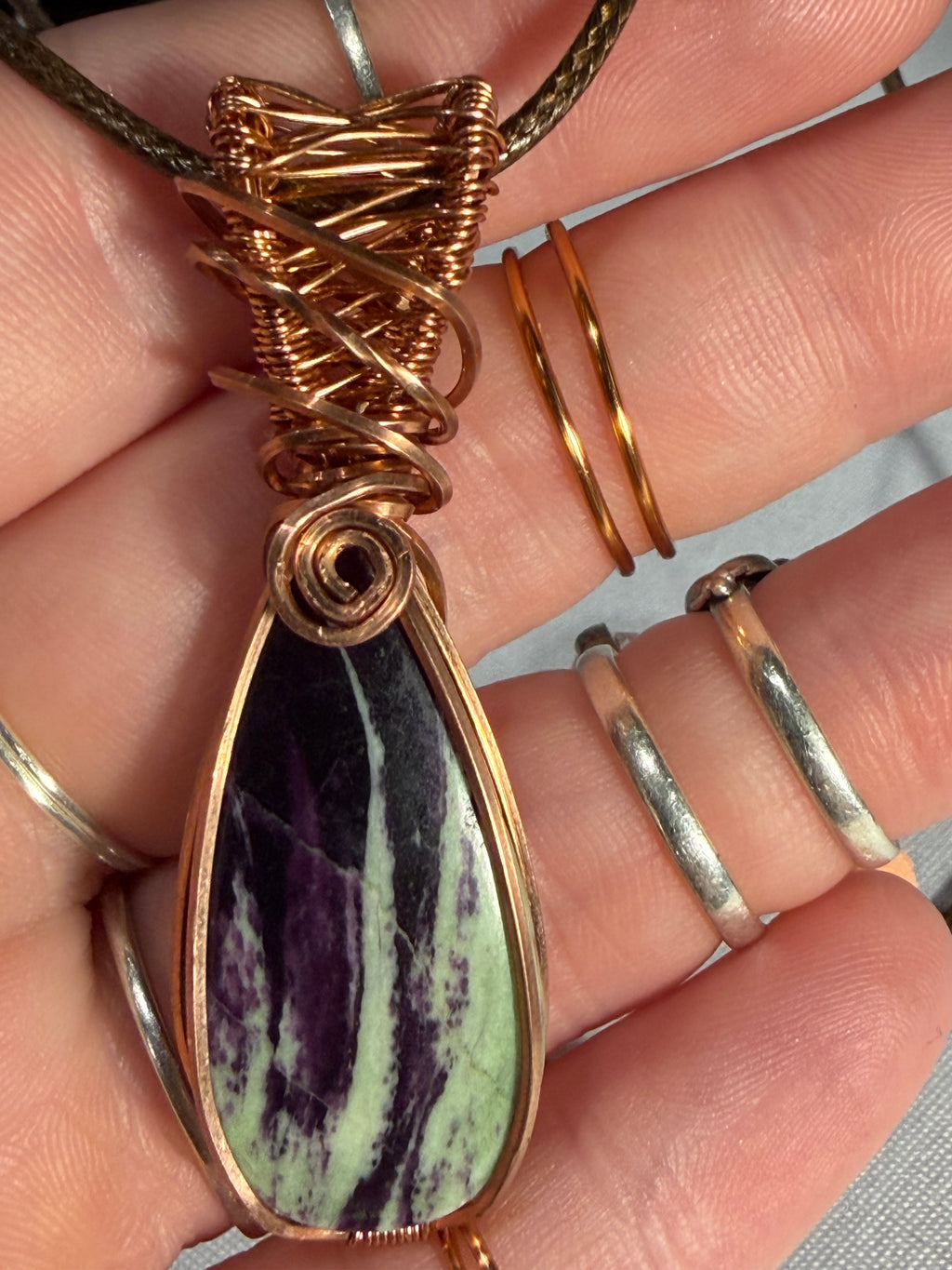 Kammererite copper wire-wrapped pendant