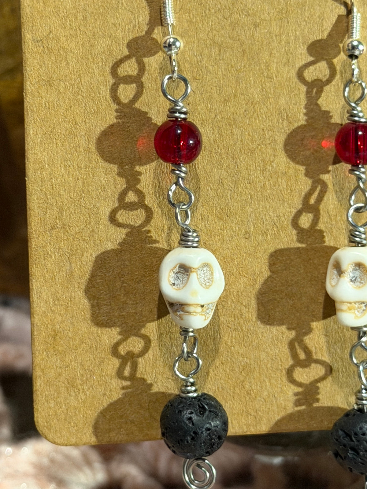 Lava stone & glass beaded skull earrings