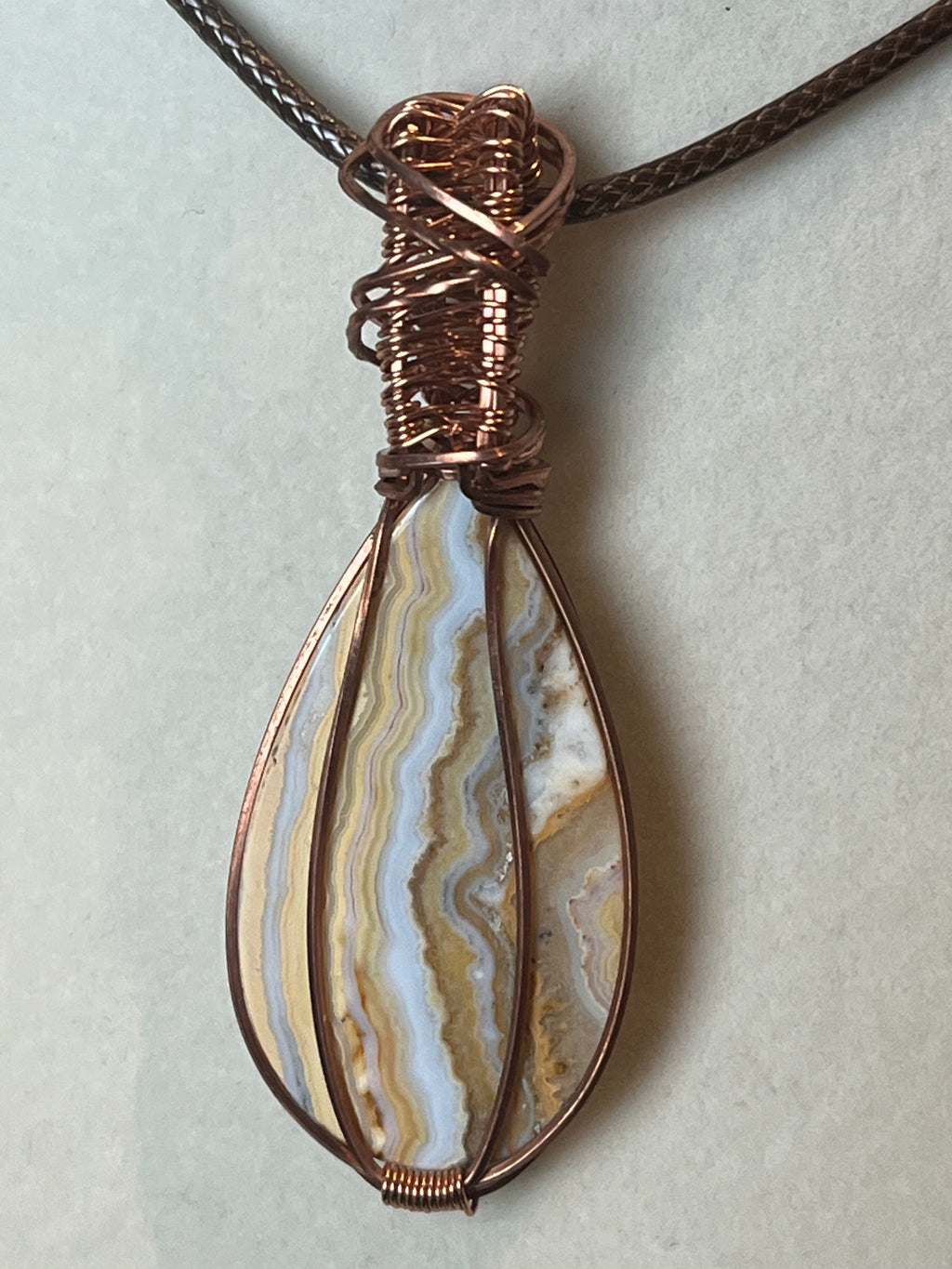 Crazy Lace Agate copper wire-wrapped pendant