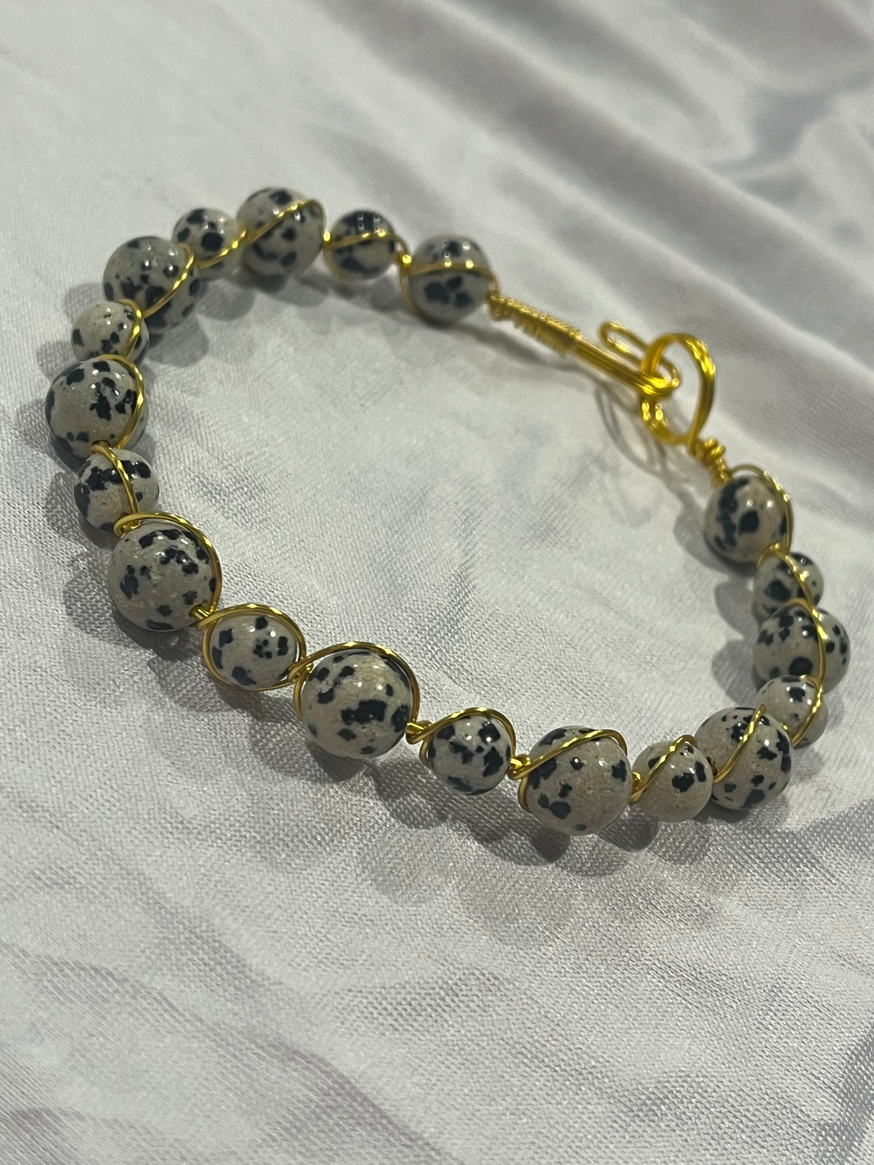 Dalmatian Jasper 7.5 inch gold-tone copper wire wrapped bracelet