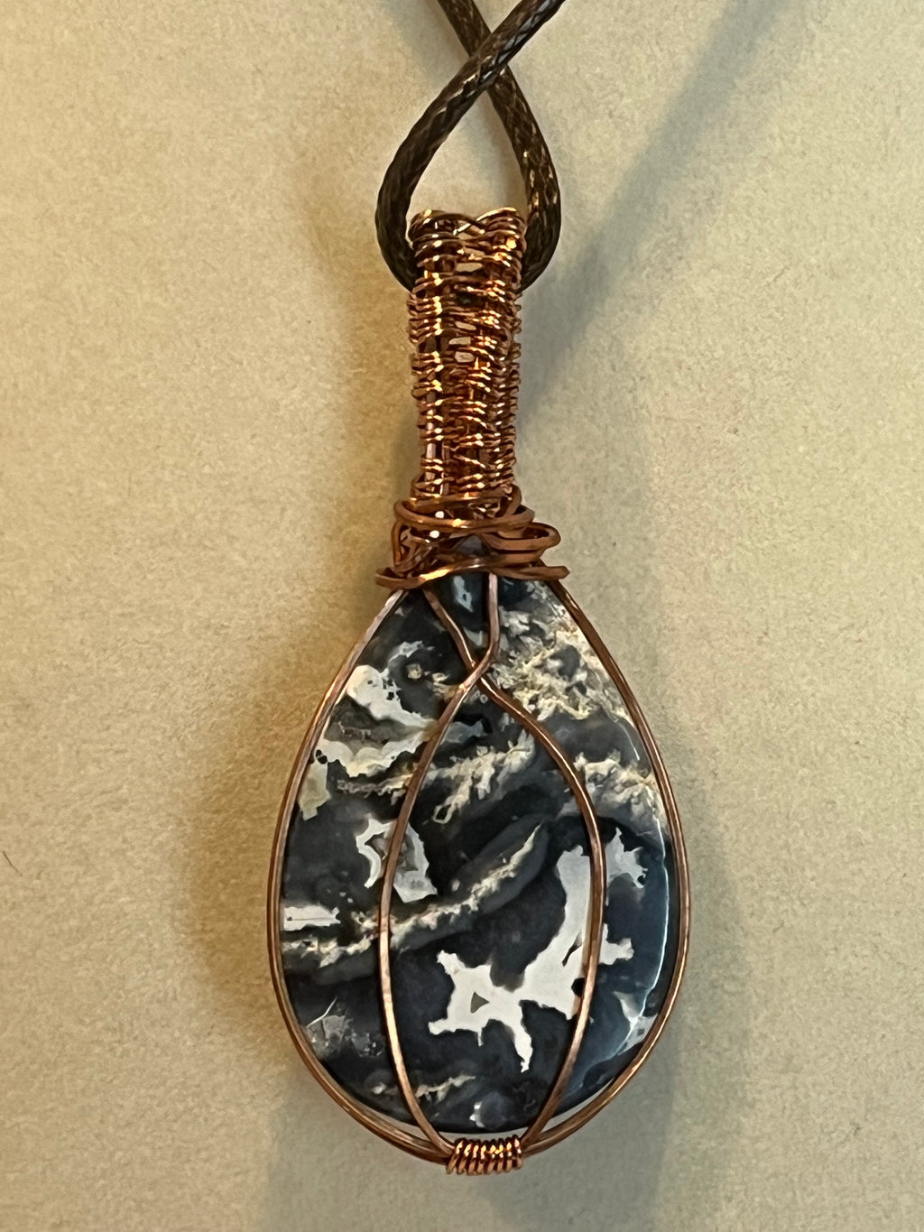 Plume agate teardrop copper wire-wrapped pendant