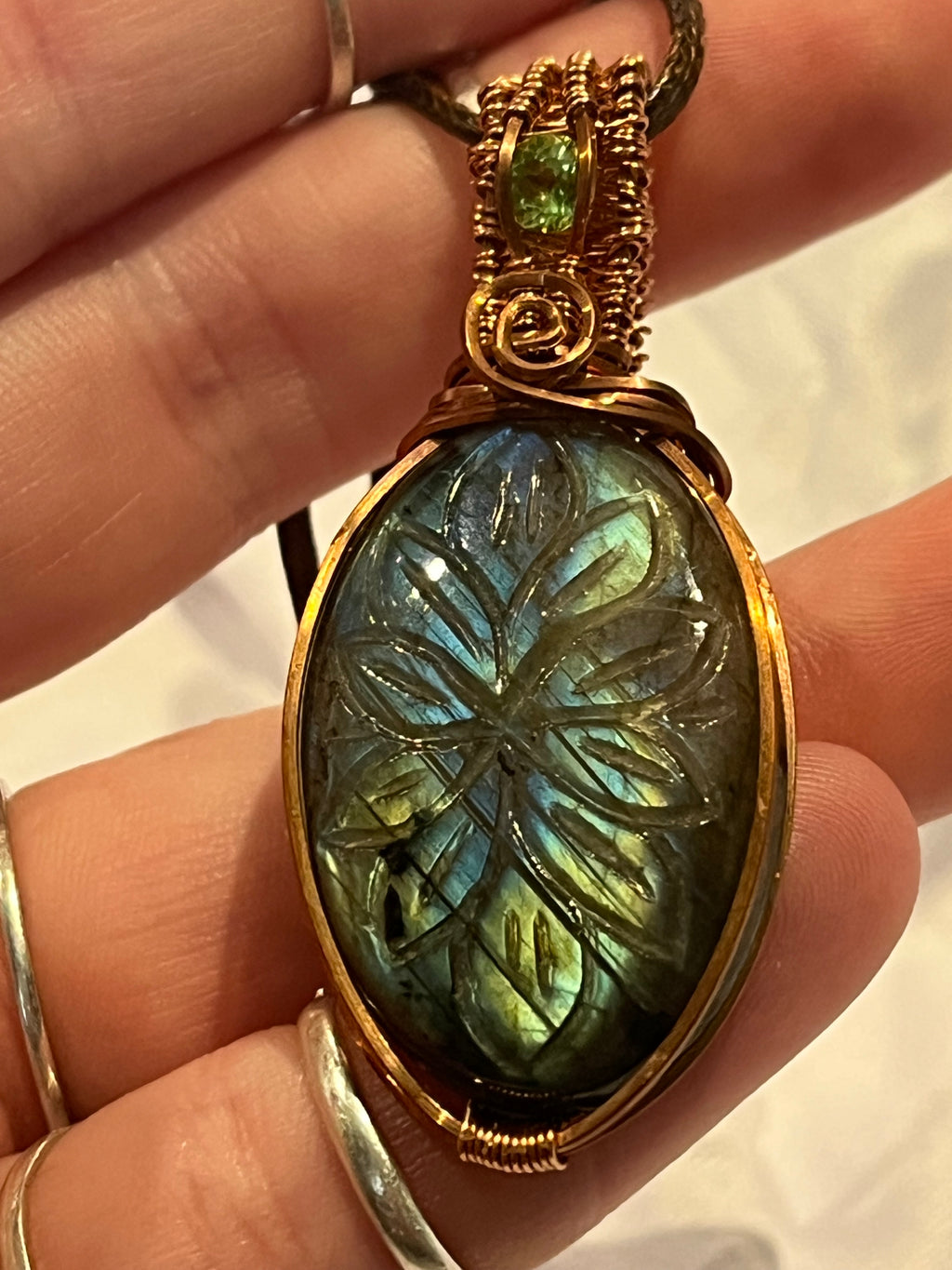 Green & blue flash Labradorite flower carving & Peridot copper wire-wrapped pendant