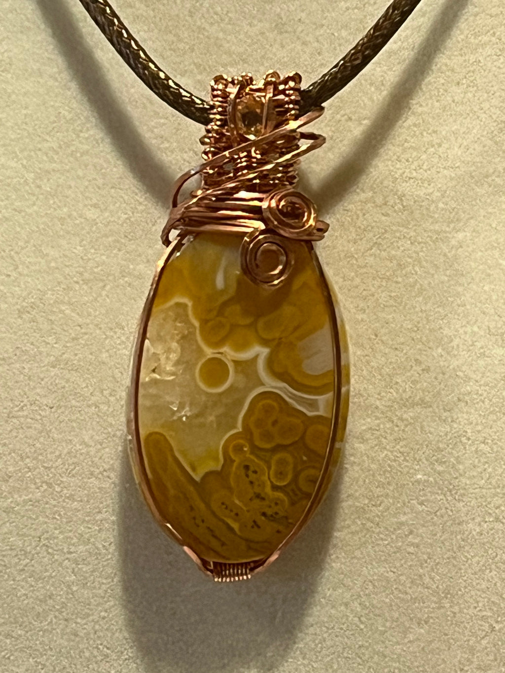 Crazy Lace Agate & Orbicular Jasper copper wire-wrapped pendant with Citrine facet