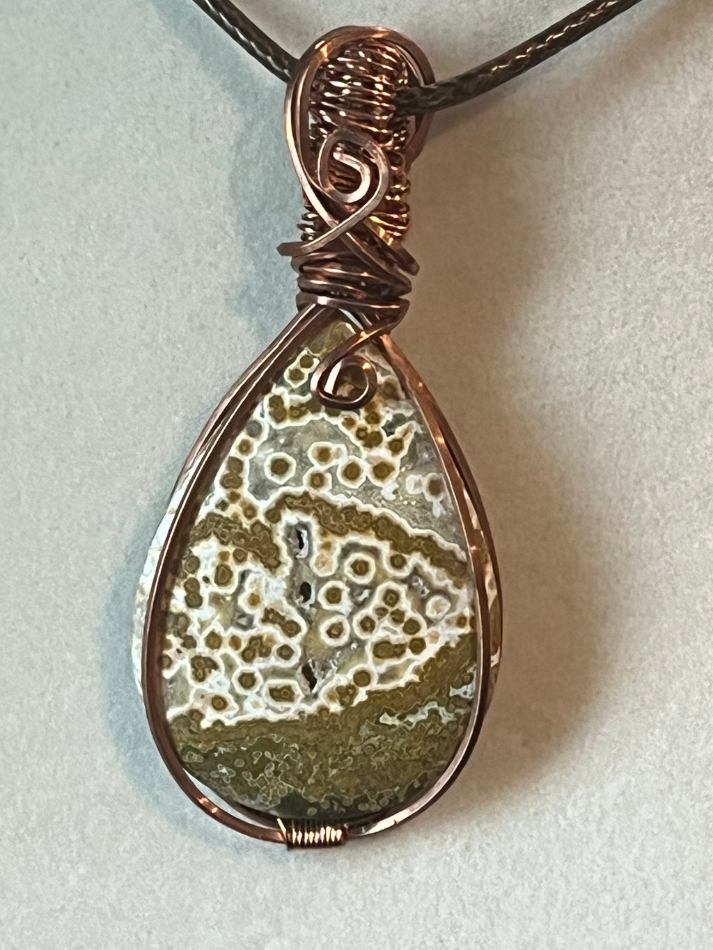 Orbicular Jasper copper wire-wrapped pendant