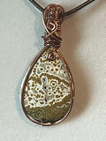 Orbicular Jasper copper wire-wrapped pendant