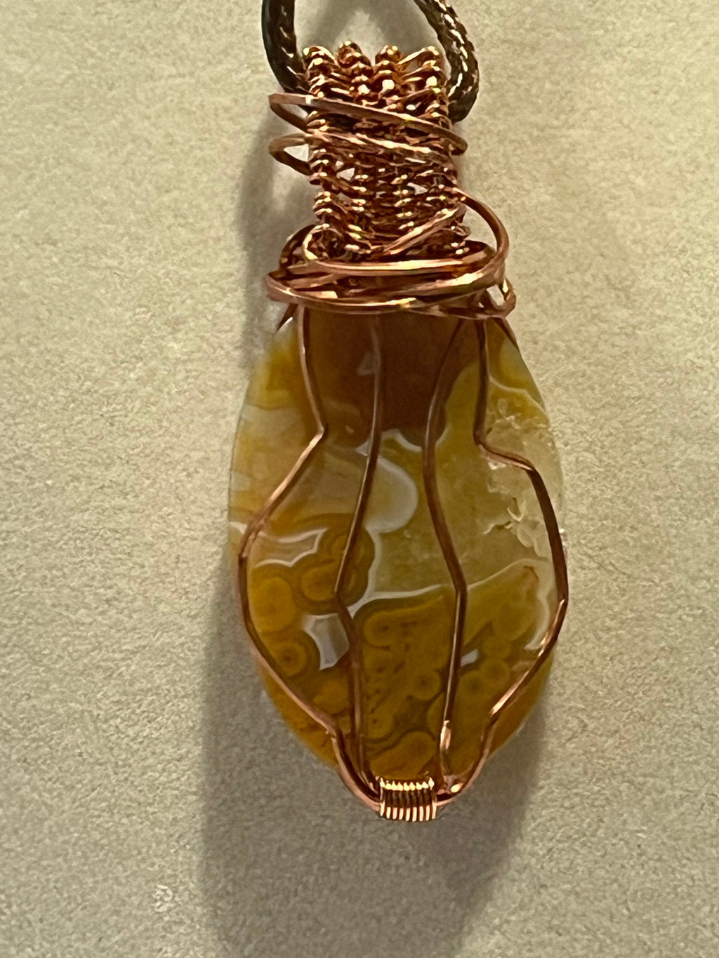Crazy Lace Agate & Orbicular Jasper copper wire-wrapped pendant with Citrine facet