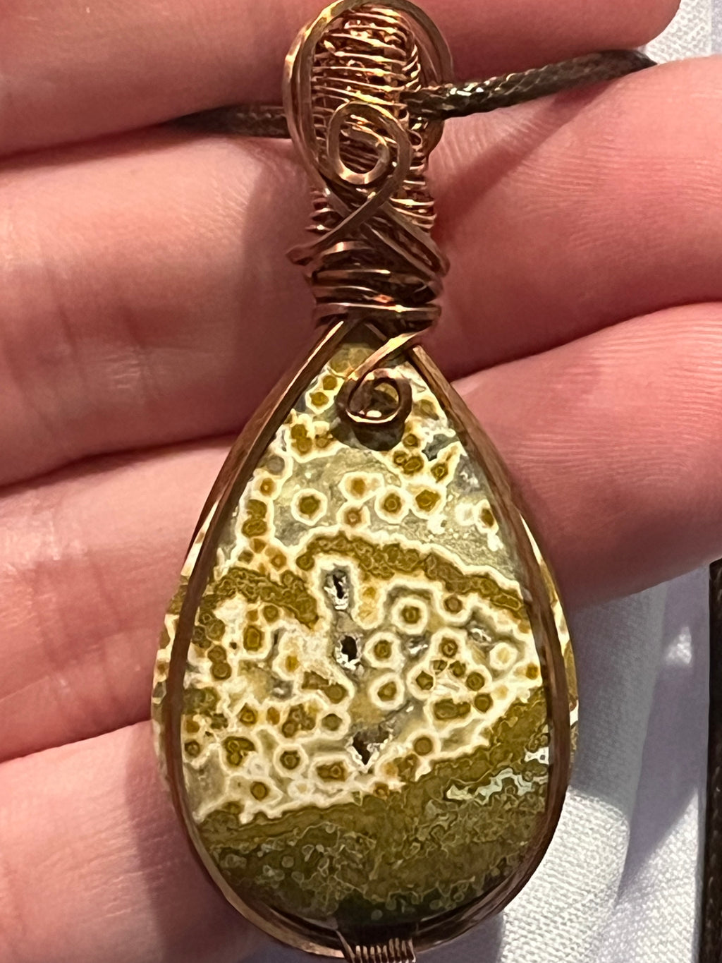 Orbicular Jasper copper wire-wrapped pendant