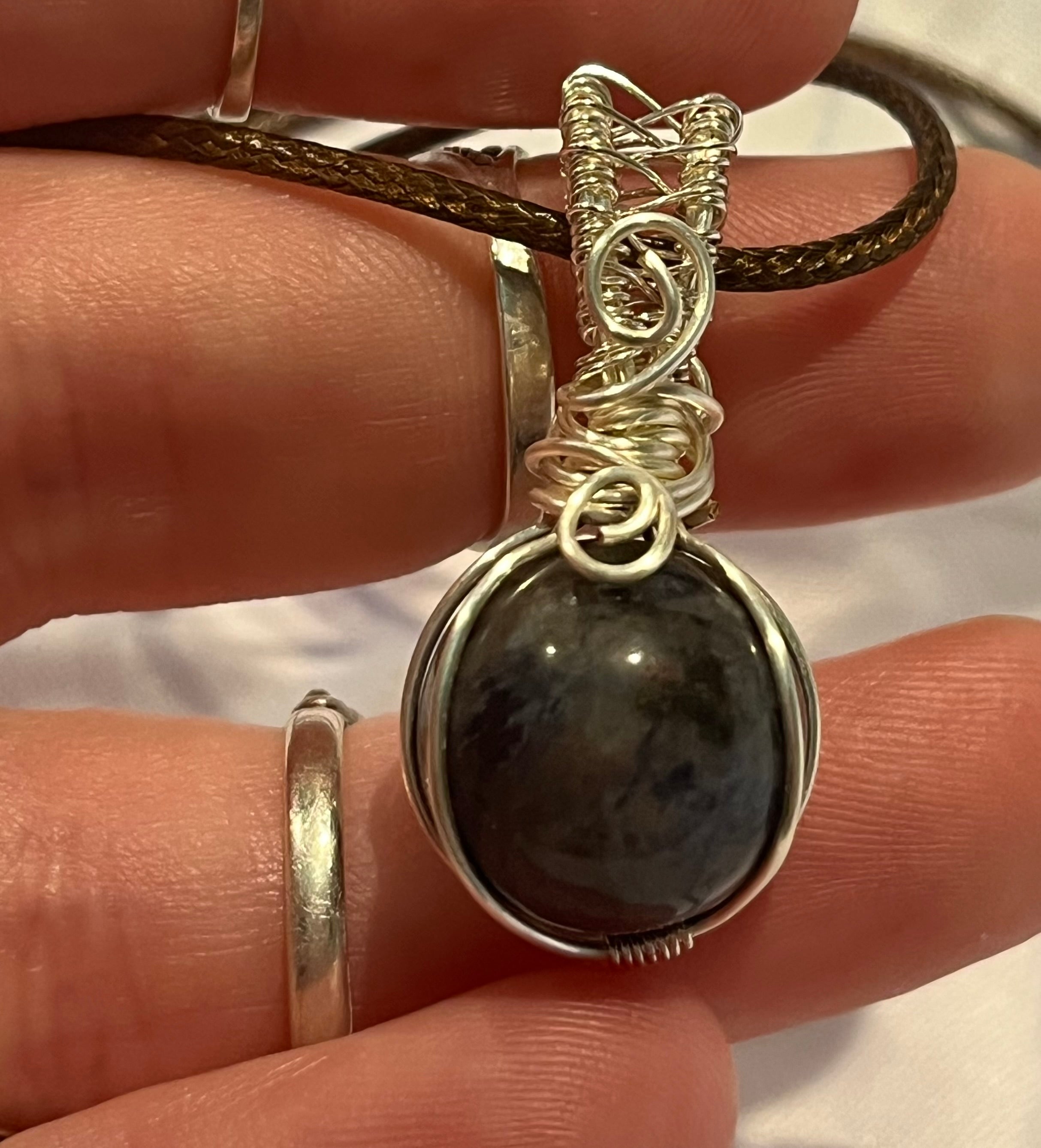 Sodalite sphere silver-tone coated copper wire-wrapped pendant